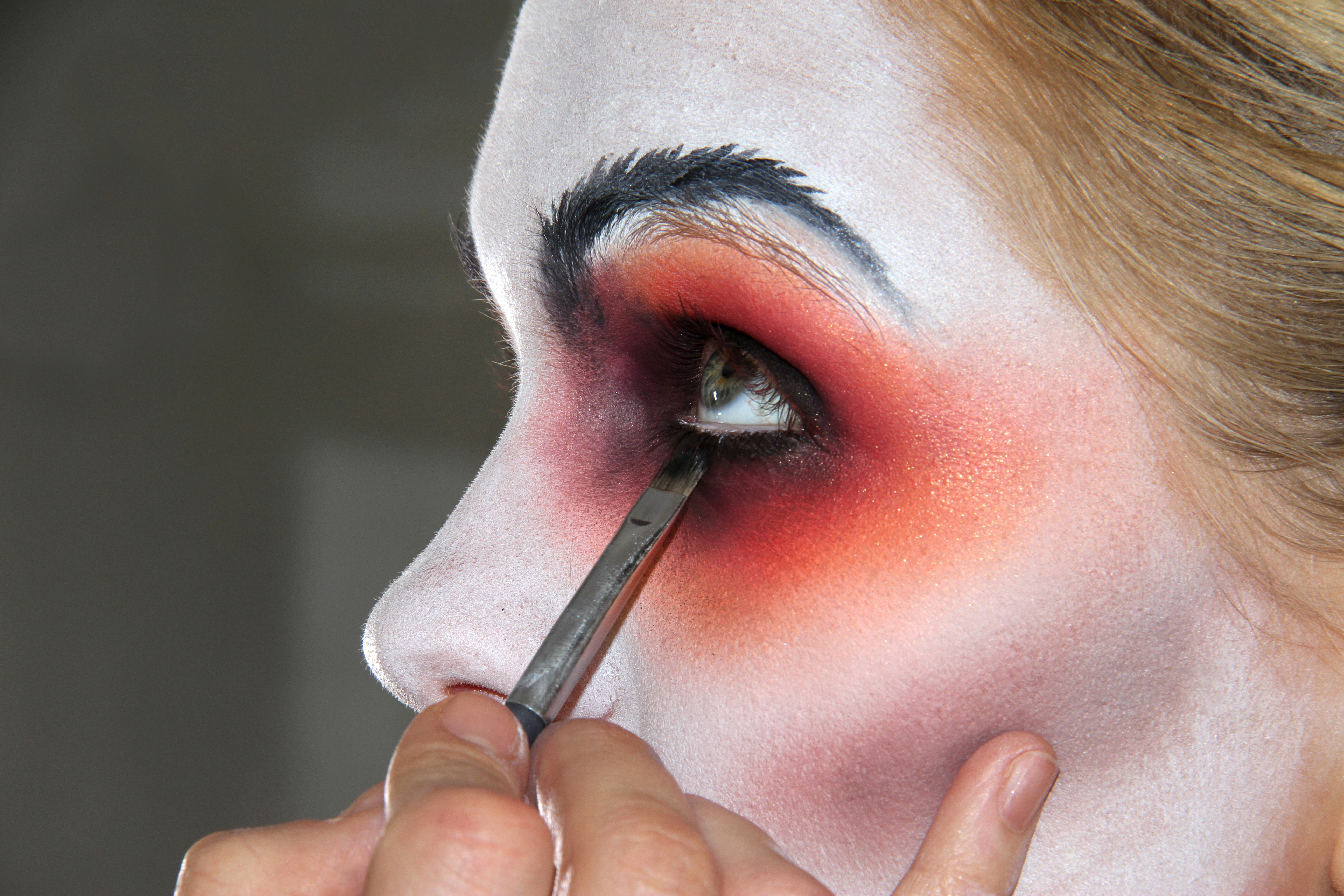 woman-applying-halloween-makeup