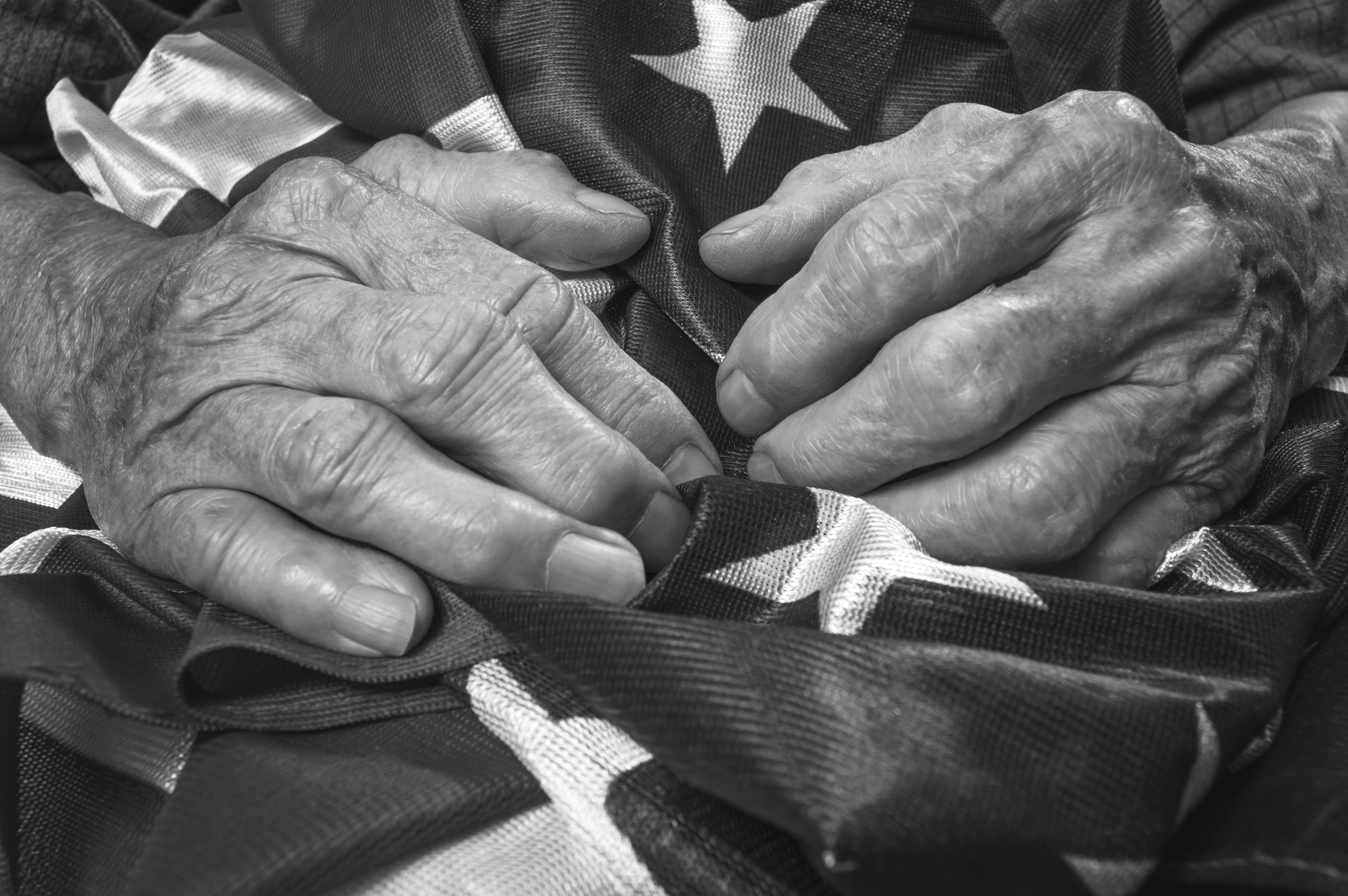 veterans-hands-on-American-flag