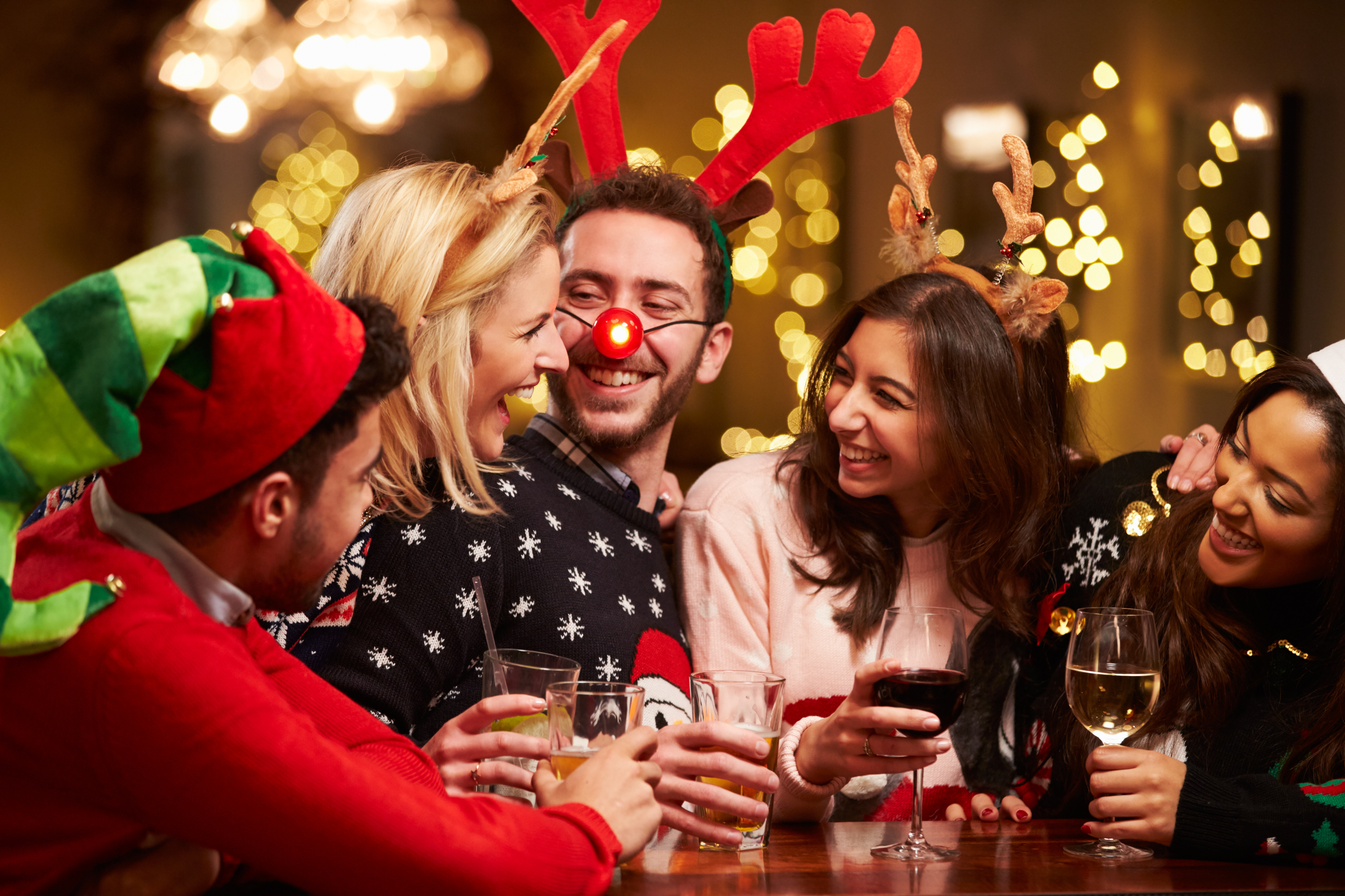 group-of-friends-enjoying-drinks-christmas