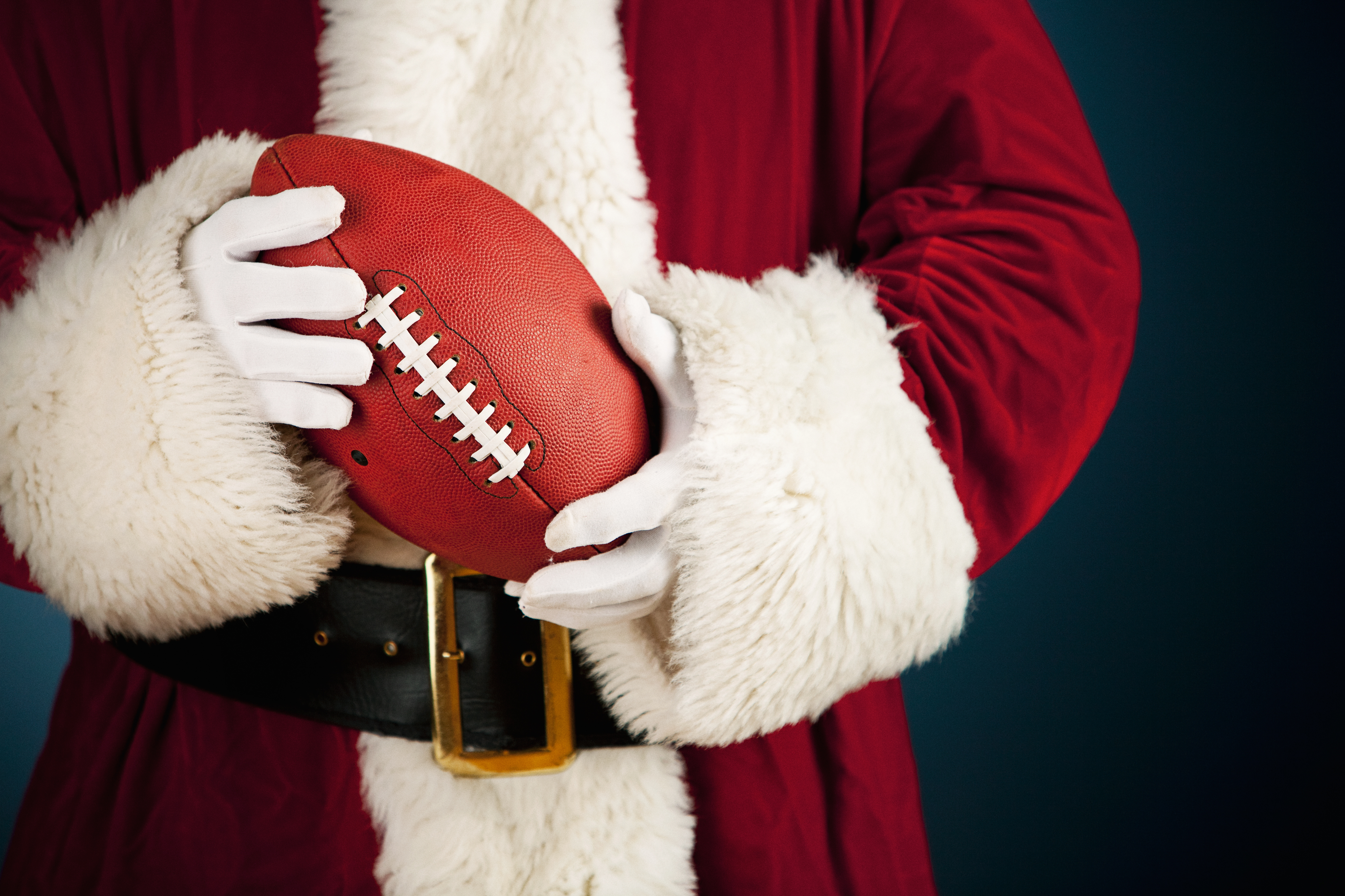 santa-holding-a-football