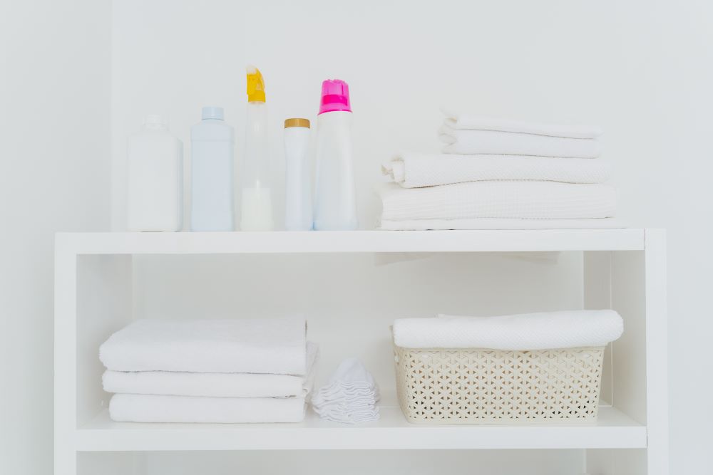 Organize A Laundry Room - Bookshelf With Folded Towels