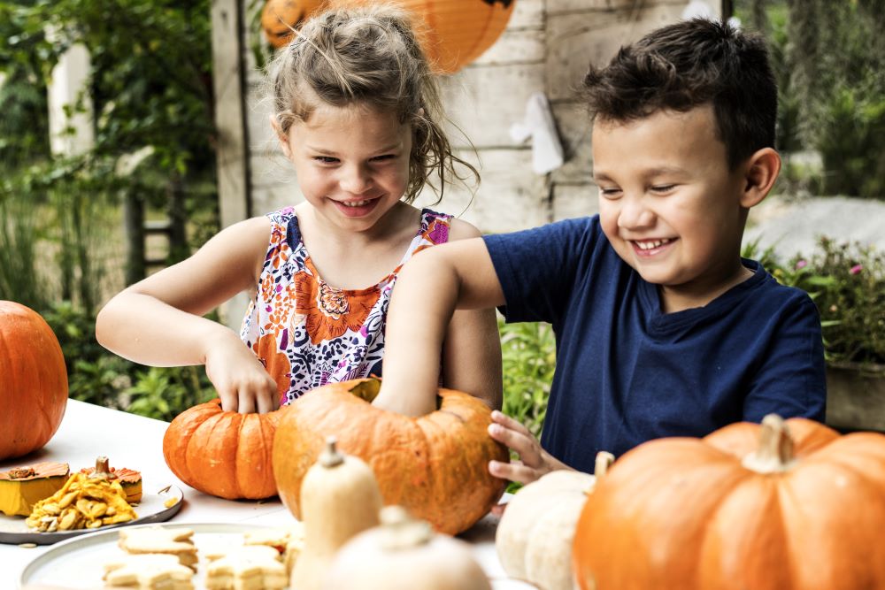 kids carving pumpkins