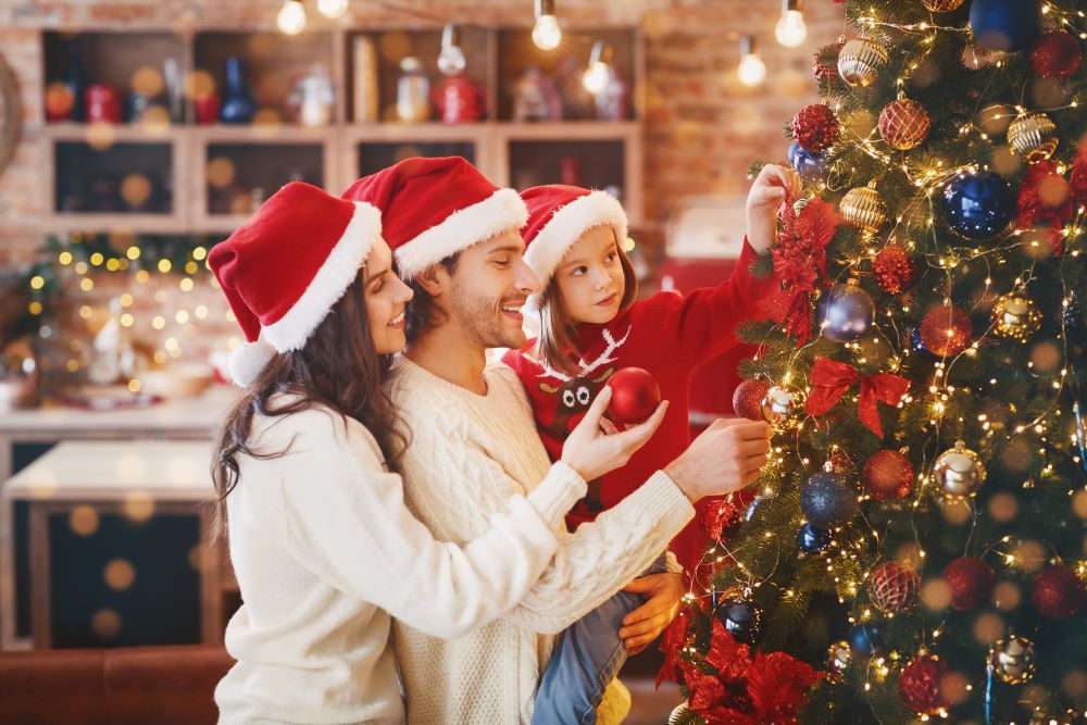 Family decorating the Christmas tree