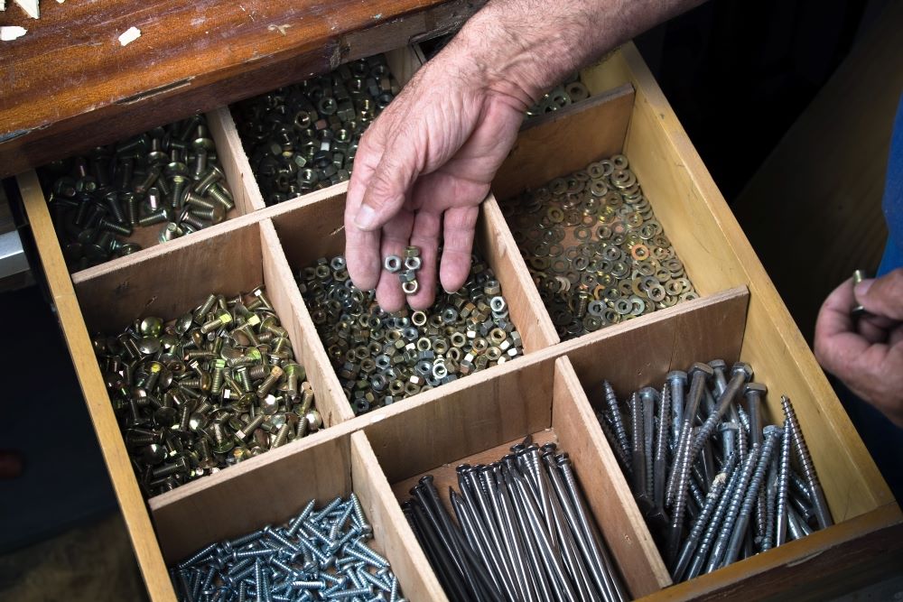 Use drawer dividers in garage for screws and tools